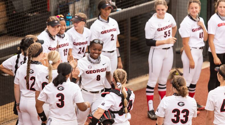 Georgia outfielder Jayda Kearney (8) gets high fives from her teammates before the Alabama game at the Jack Turner Softball Stadium in Athens on Friday, Apr. 30, 2021. (Photo by Mackenzie Miles/UGA Athletics)