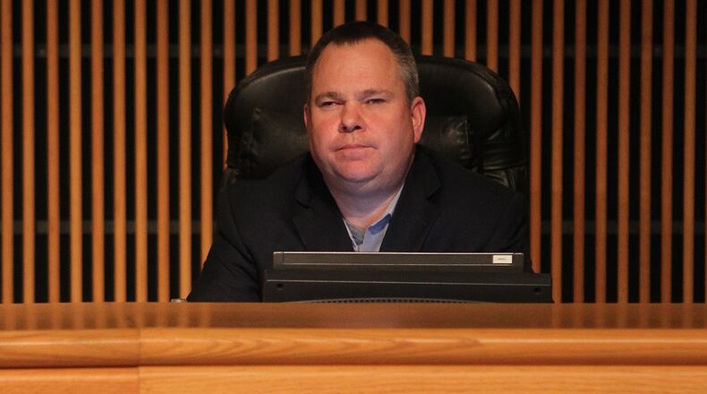 January 17, 2017, Atlanta - Commissioner Tommy Hunter listens to Gwinnett county citizens who came to speak out against his words aimed at John Lewis on Facebook in Atlanta, Georgia, on Tuesday, January 17, 2017. (HENRY TAYLOR / HENRY.TAYLOR@AJC.COM)