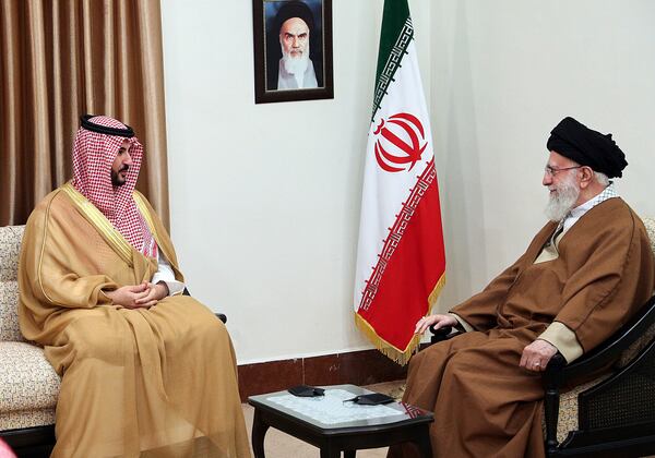 In this photo released by the official website of the office of the Iranian supreme leader, Supreme Leader Ayatollah Ali Khamenei, right, listens to Saudi Arabia's Defense Minister Prince Khalid bin Salman during their meeting in Tehran, Iran, Thursday, April 17, 2025. (Office of the Iranian Supreme Leader via AP)