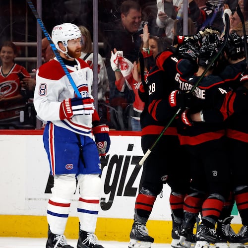 Carolina Hurricanes players celebrate after a goal by Eric Robinson as Montreal Canadiens' Mike Matheson (8) skates by during the first period in Game 5 of the Eastern Conference finals NHL hockey Stanley Cup playoff series in Raleigh, N.C., Friday, May 29, 2026. (AP Photo/Karl DeBlaker)