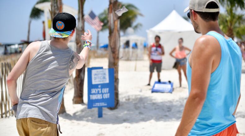 GULF SHORES, AL - MAY 19: Festivalgoers play cornhole at the 2017 Hangout Music Festival on May 19, 2017 in Gulf Shores, Alabama. (Photo by Matt Winkelmeyer/Getty Images for Hangout Music Festival)