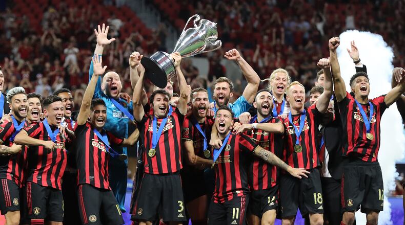 August 27, 2019 Atlanta: Atlanta United players hoist the Lamar Hunt Trophy after defeating Minnesota United 2-1 to win the U.S. Open Cup on Tuesday, August 27, 2019, in Atlanta.  Curtis Compton/ccompton@ajc.com