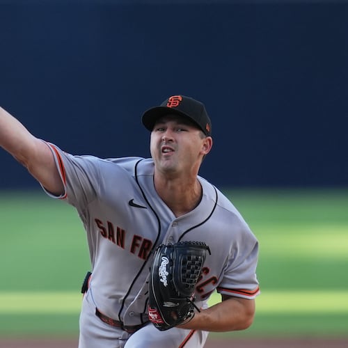 San Francisco Giants starting pitcher Tyler Mahle works against a San Diego Padres batter during the second inning of a baseball game Saturday, Aug. 1, 2026, in San Diego. (AP Photo/Gregory Bull)