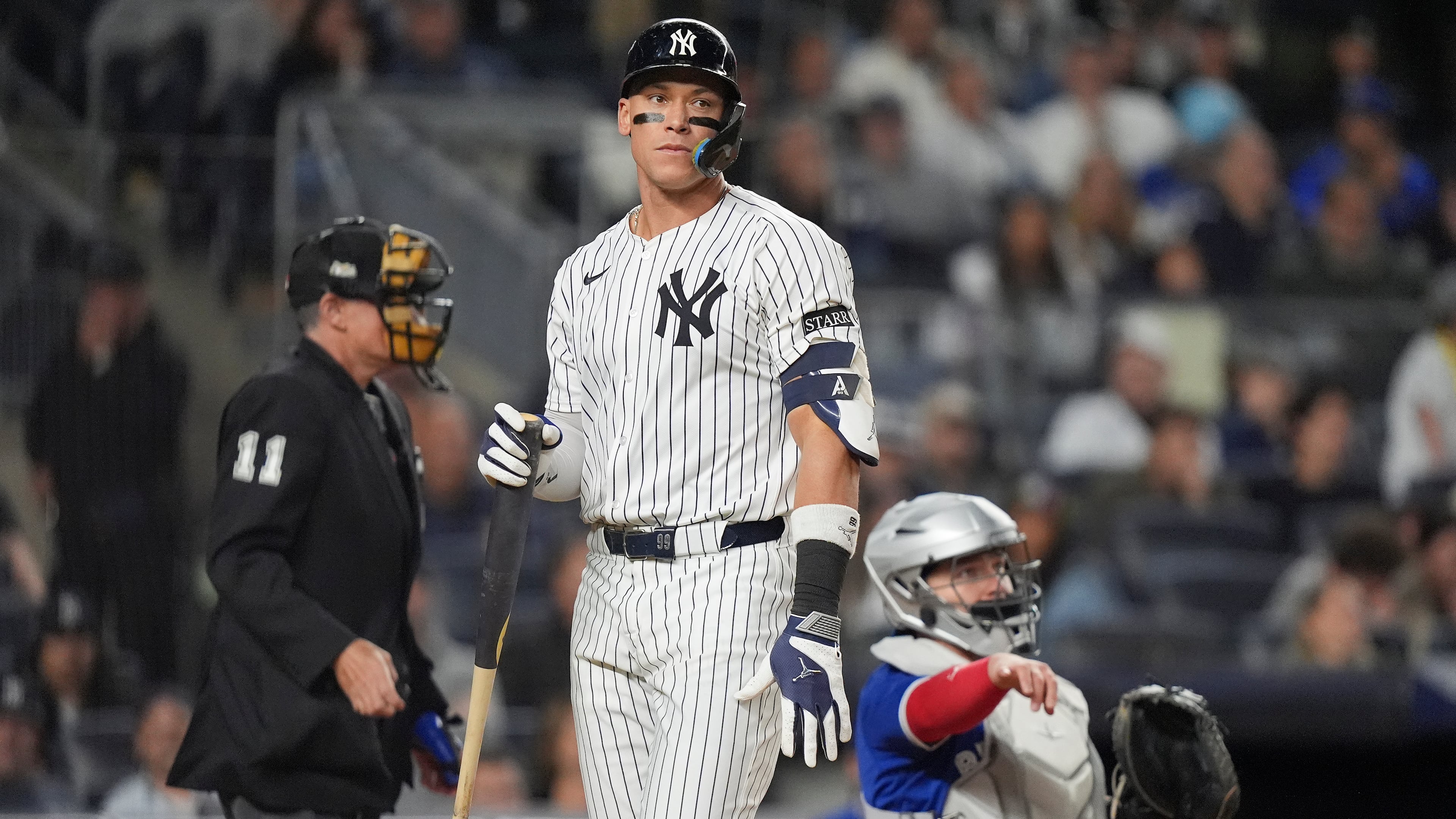 New York Yankees' Aaron Judge reacts after striking out against the Toronto Blue Jays during the eighth inning of Game 4 of baseball's American League Division Series, Wednesday, Oct. 8, 2025, in New York. (AP Photo/Frank Franklin II)