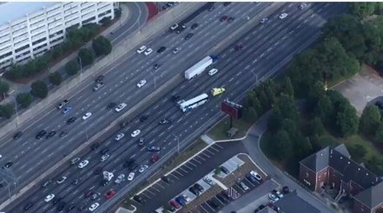 HERO pulling the GRTA bus to the right lanes after it stalled in the center lane. (Credit:WSB Radio)