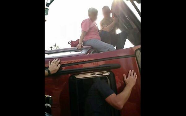 Marietta  police blurred the faces of the driver and her rescuers at their request.