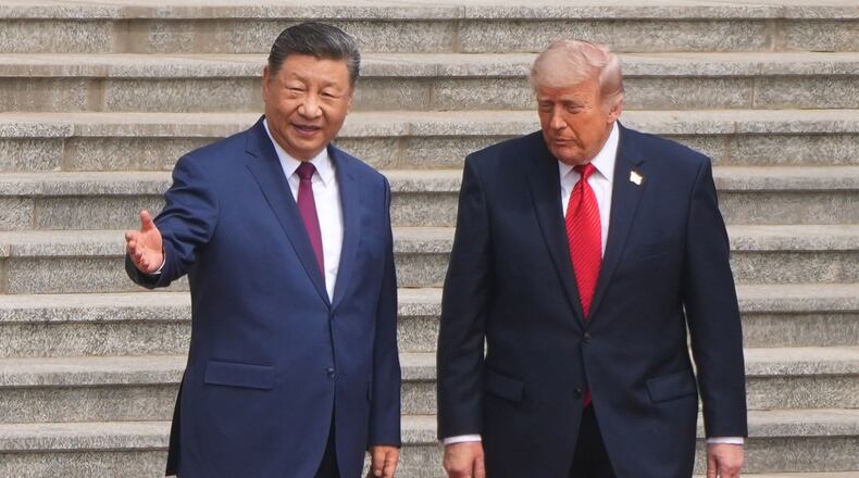 FILE - President Donald Trump participates in a welcome ceremony with China's President Xi Jinping at the Great Hall of the People, May 14, 2026, in Beijing. (AP Photo/Mark Schiefelbein, File)