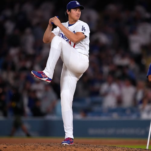 Los Angeles Dodgers' Shohei Ohtani fakes a pitch after the Dodgers defeated the against the Colorado Rockies in a baseball game Wednesday, July 8, 2026, in Los Angeles. (AP Photo/Mark J. Terrill)