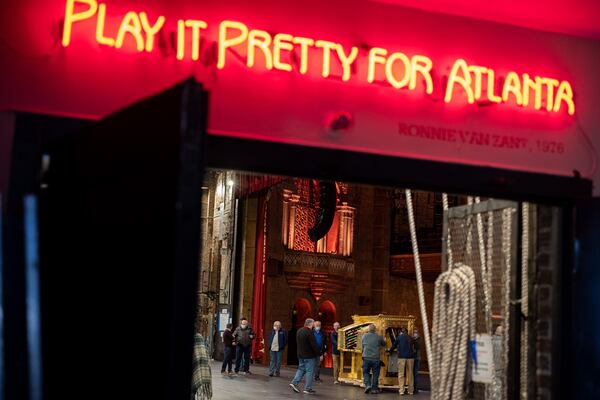 The famous 1976 quote by Lynyrd Skynyrd vocalist Ronnie Van Zant lights up above a stage doorway inside the Fox Theatre. Ben Gray for the Atlanta Journal-Constitution