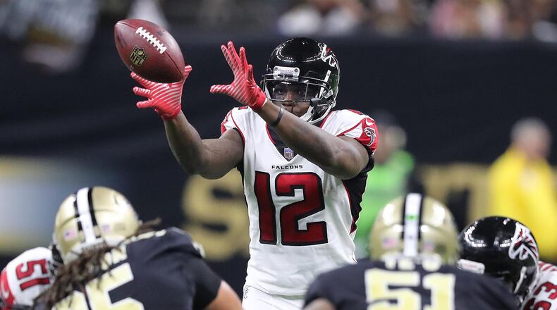 Falcons wide receiver Mohamed Sanu takes a snap at quarterback against the Saints during the second half in a NFL football game on Sunday, December 24, 2017, in New Orleans.