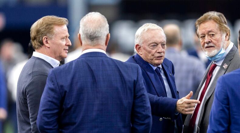 NFL Commissioner Roger Goodell, left, Dallas Cowboys Chief Operating Officer/Executive Vice President Stephen Jones, second from left, Dallas Cowboys owner Jerry Jones, third from left, and San Francisco 49ers co-chair John York, right, are seen on the sidelines before a wild card NFL football game against the San Francisco 49ers, Sunday, Jan. 16, 2022, in Arlington, Texas. (AP Photo/Brandon Wade)