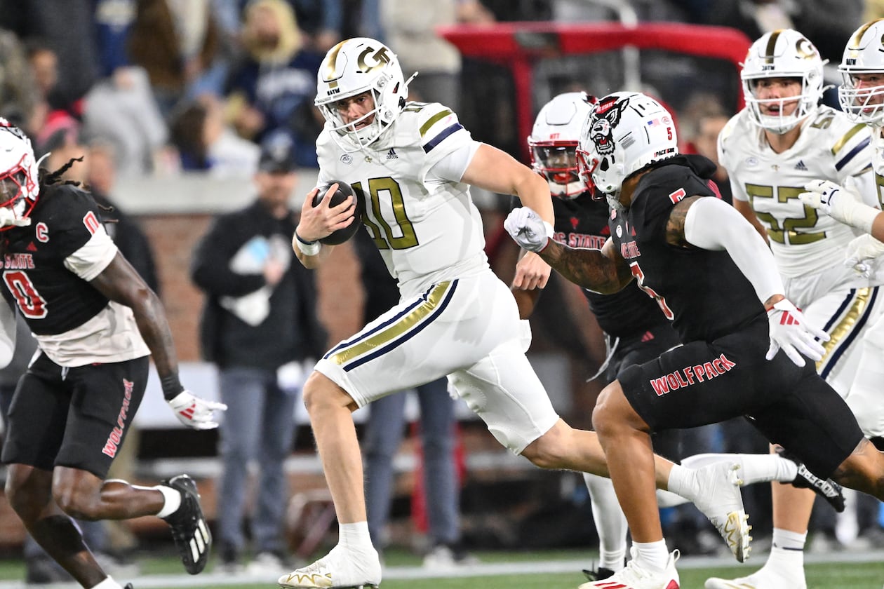 Georgia Tech quarterback Haynes King runs the ball during the first half of its Nov. 21, 2024,game against N.C. State. (Hyosub Shin/AJC)