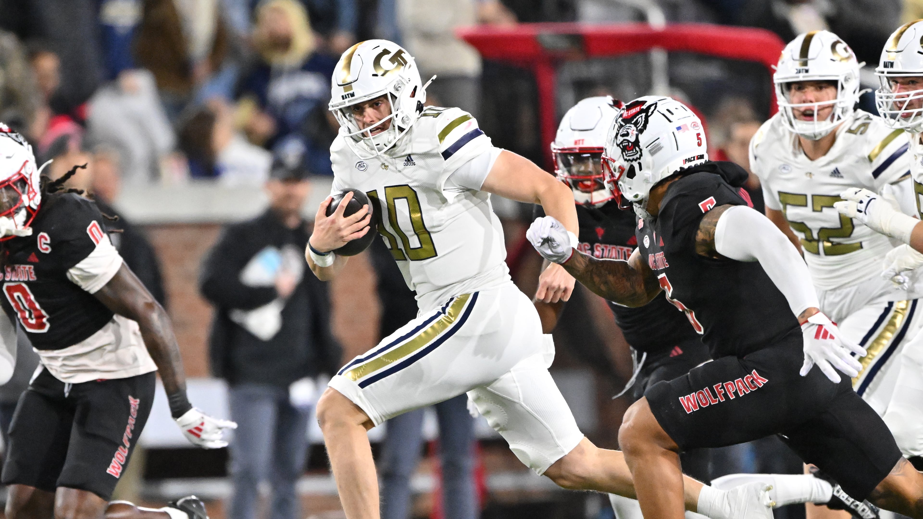 Georgia Tech quarterback Haynes King runs the ball during the first half of its Nov. 21, 2024,game against N.C. State. (Hyosub Shin/AJC)