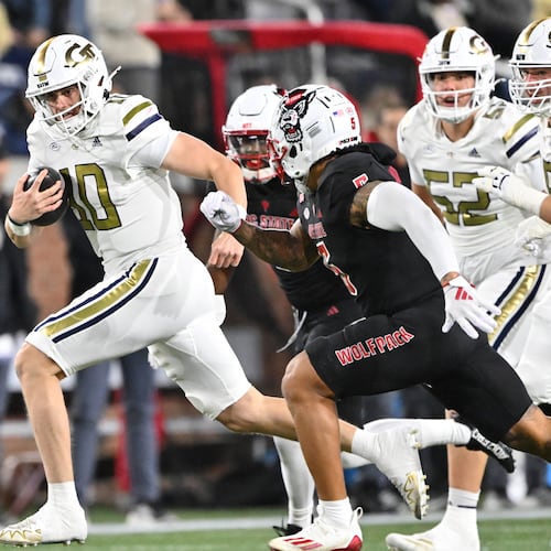Georgia Tech quarterback Haynes King runs the ball during the first half of its Nov. 21, 2024,game against N.C. State. (Hyosub Shin/AJC)