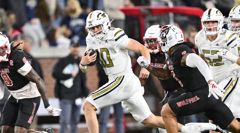 Georgia Tech quarterback Haynes King runs with a ball during the first half of an NCAA college football game at Georgia Tech's Bobby Dodd Stadium, Thursday, Nov. 21, 2024, in Atlanta. (Hyosub Shin/AJC)