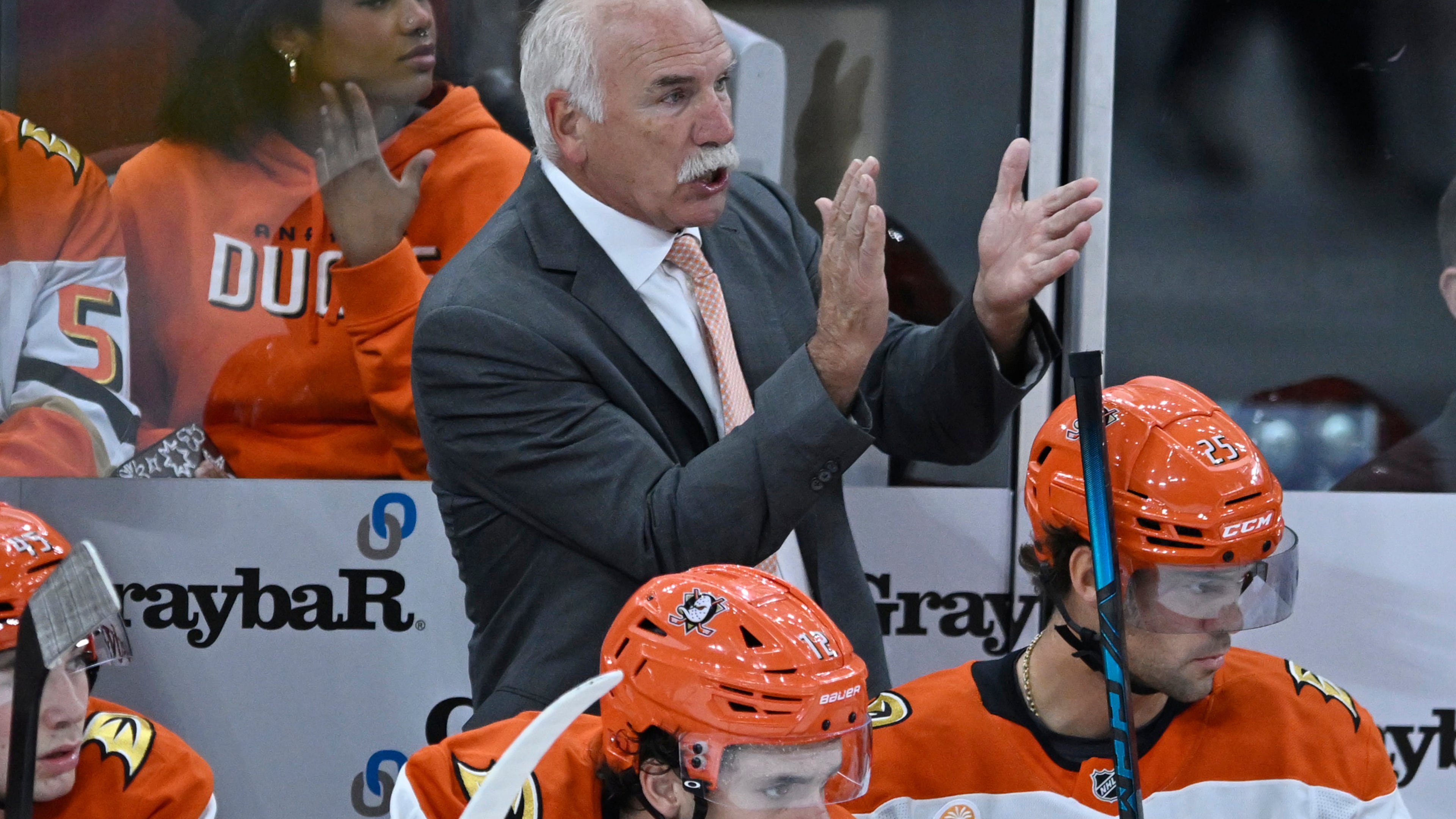 Anaheim Ducks head coach Joel Quenneville, center top, yells to his players during the second period of an NHL hockey game against the Chicago Blackhawks, Sunday, Oct. 19, 2025, in Chicago. (AP Photo/Paul Beaty)