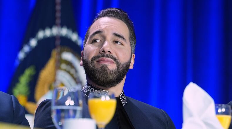 FILE - President of El Salvador, Nayib Armando Bukele Ortez, listens as President Donald Trump speaks during the National Prayer Breakfast, Feb. 5, 2026, in Washington. (AP Photo/Evan Vucci, File)