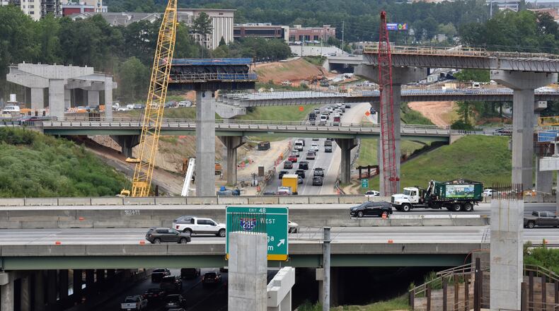 August 9 2019 Sandy Springs/Atlanta - Picture shows construction site of I-285 interchange at Ga. 400 in Sandy Springs on Friday, August 8, 2019. I-285 is showed in foreground (horizontal) and Ga. 400 northbound is shown in middle (south to north). Construction is peaking on one of the biggest road projects in Georgia history, and motorists are enduring the hassles that come with it. The new $800 million I-285 interchange at Ga. 400 in Sandy Springs will be bigger than Spaghetti Junction, and the scale of the work is becoming visible as new rise ramps above the existing interchange. When itâs completed, it will ease traffic at one of the busiest stretches of highway in the Southeast and serve as a linchpin for metro Atlantaâs growing network of toll lanes. In the meantime, commuters must navigate a constant maze of lane and road closures, detours and congestion. (Hyosub Shin / Hyosub.Shin@ajc.com)