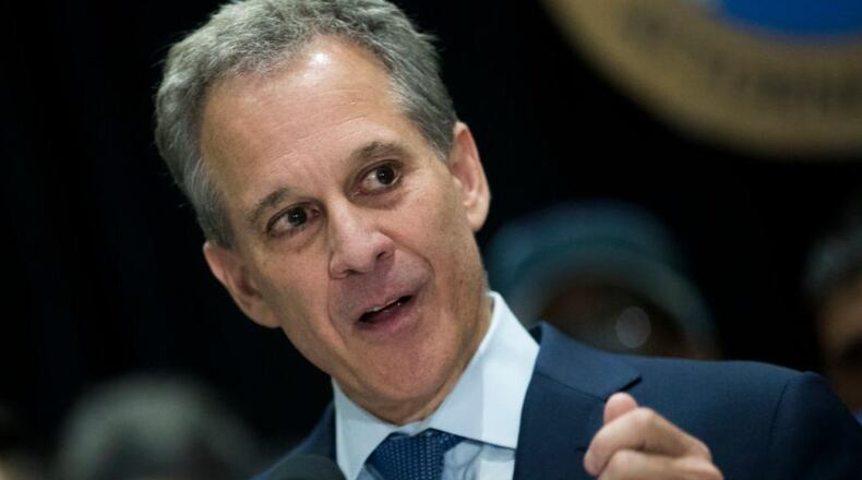 Surrounded by DACA recipients and immigration activists, New York Attorney General Eric Schneiderman speaks during a press conference to announce the filing of a multi-state lawsuit to protect DACA recipients, at John Jay College of Criminal Justice, September 6, 2017 in New York City. (Photo by Drew Angerer/Getty Images)