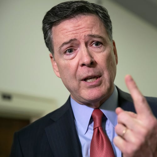 FILE - Former FBI Director James Comey speaks to reporters on Capitol Hill Washington, Dec. 17, 2018. (AP Photo/J. Scott Applewhite, File)