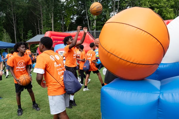 Kids shoot hoops during the At-Promise Field Day hosted by the Atlanta Police Foundation at the Atlanta Public Safety Training Center on Friday, June 27, 2025. (Ben Gray for the AJC)