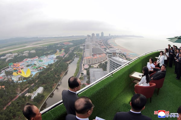 In this photo provided by the North Korean government, North Korean leader Kim Jong Un, sitting center, with his wife Ri Sol Ju, rear, and daughter tours the Wonsan-Kalma coastal tourist zone in North Korea Tuesday, June 24, 2025. Independent journalists were not given access to cover the event depicted in this image distributed by the North Korean government. The content of this image is as provided and cannot be independently verified. Korean language watermark on image as provided by source reads: "KCNA" which is the abbreviation for Korean Central News Agency. (Korean Central News Agency/Korea News Service via AP)