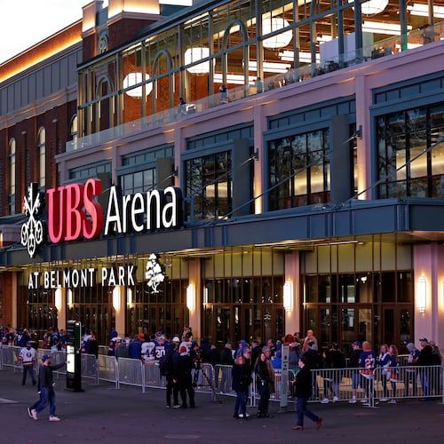 FILE - Fans wait to enter the new UBS Arena for the first New York Islanders NHL hockey game against the Calgary Flames, Nov. 20, 2021, in Elmont, N.Y. (AP Photo/Adam Hunger, File)wld