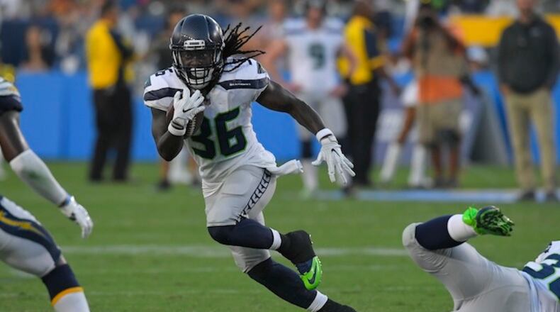 Seattle Seahawks running back Alex Collins runs upfield during the second half of an NFL preseason football game against the Los Angeles Chargers Sunday, Aug. 13, 2017, in Carson, Calif. (AP Photo/Mark J. Terrill)
