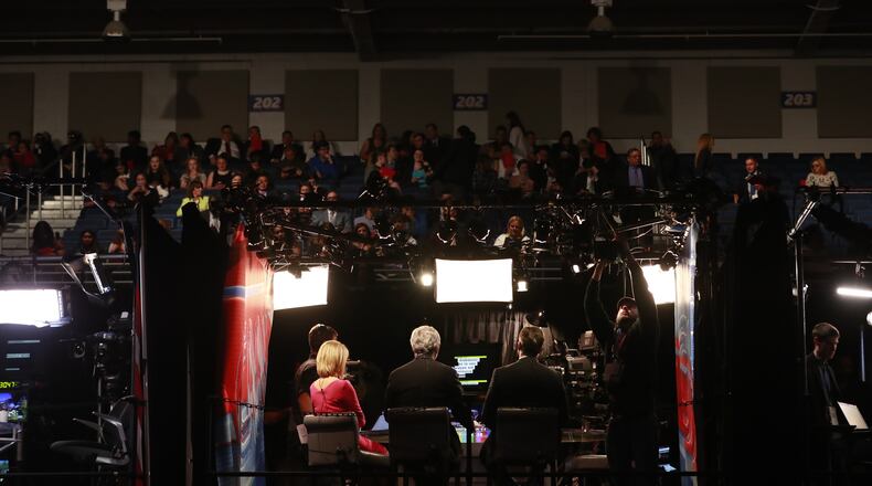 CNN broadcasters, including Wolf Blitzer, center, in the media area as final preparations were underway for the first debate between Hillary Clinton and Donald Trump, at Hofstra University in Hempstead, N.Y., Sept. 26, 2016. (Doug Mills/The New York Times)
