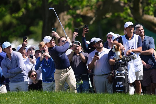 Rory McIlroy, of Northern Ireland, watches his shot on the seventh hole during the third round of the Truist Championship golf tournament at the Philadelphia Cricket Club, Saturday, May 10, 2025, in Flourtown. (AP Photo/Matt Rourke)