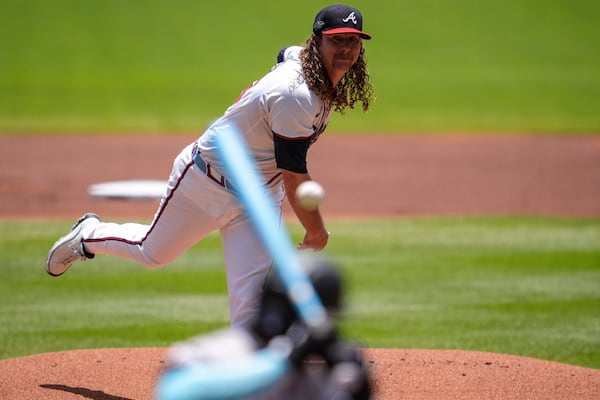 Atlanta Braves pitcher Grant Holmes (66) works against Colorado Rockies' Jordan Beck (27) in the first inning of a baseball game, Sunday, June 15, 2025, in Atlanta. (AP Photo/Mike Stewart)