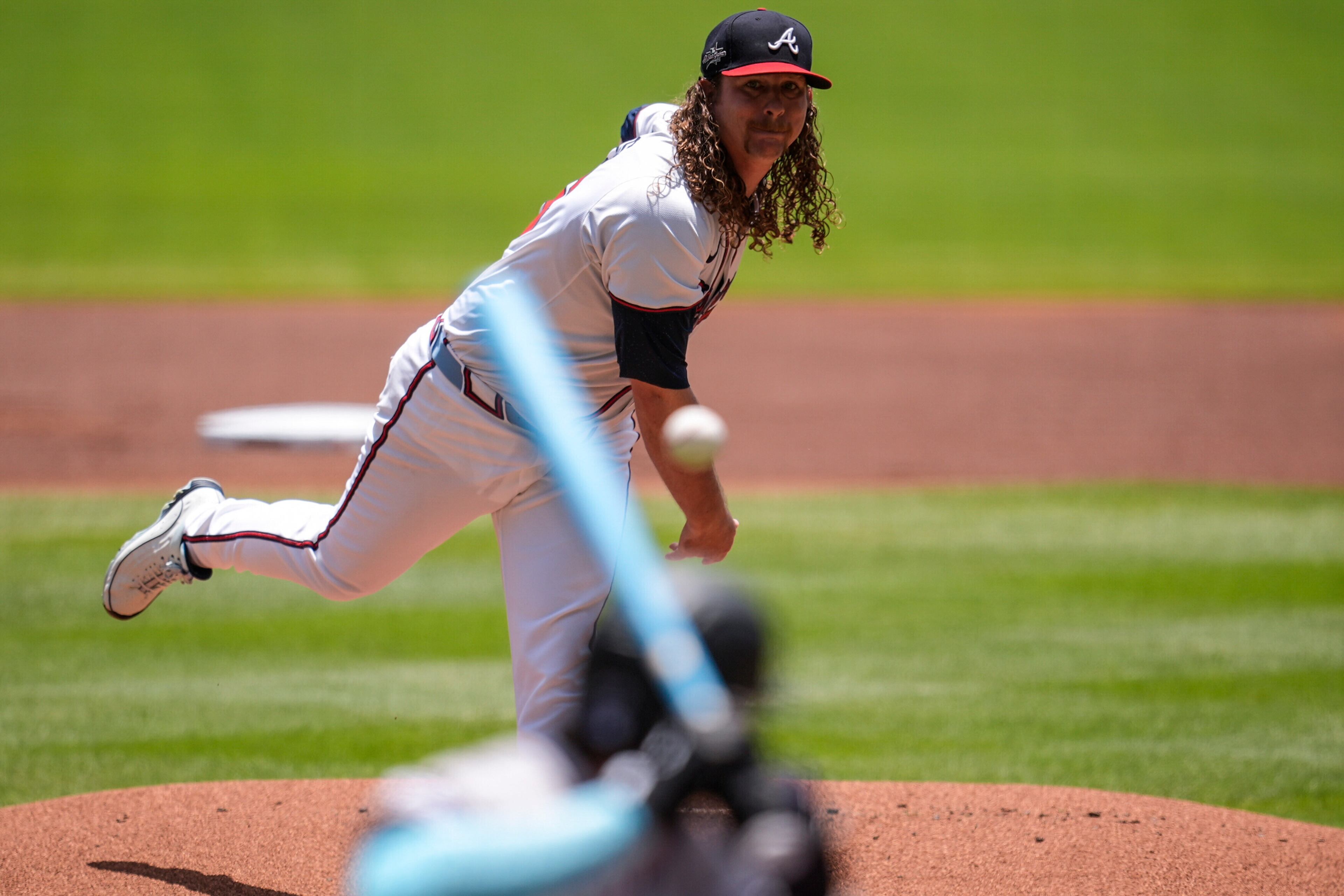 Atlanta Braves pitcher Grant Holmes pitches against the Colorado Rockies' Jordan Beck in the first inning Sunday at Truist Park in Atlanta. Holmes, who had a no-hitter through 5⅓ innings, allowed two hits and two earned runs in 6⅓ innings and took the loss. (Mike Stewart/AP)