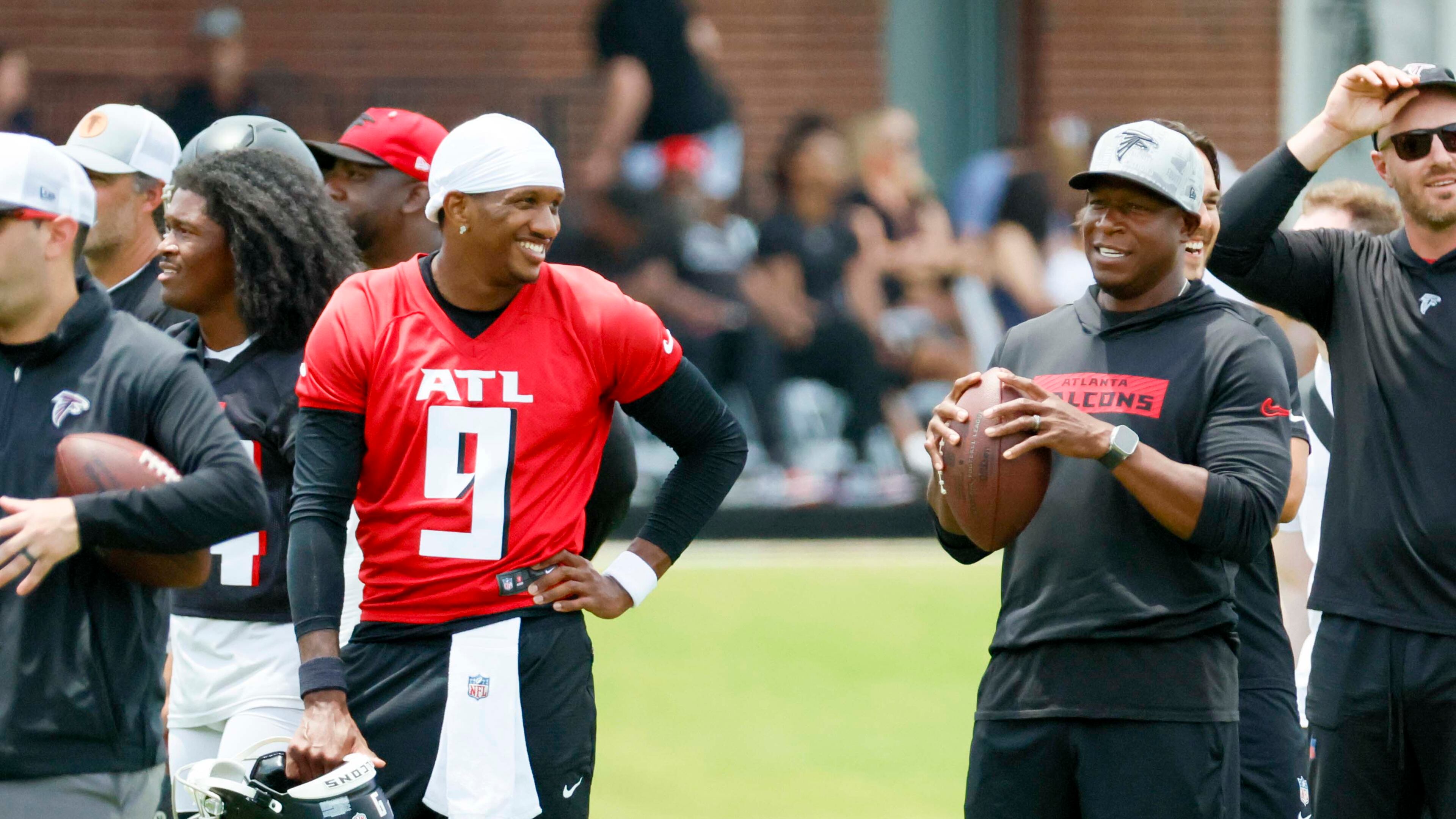Falcons quarterback Michael Penix Jr. (left) chats with head coach Raheem Morris during minicamp on Wednesday, June 11, 2025, in Flowery Branch. Morris will collaborate with his coaching staff to get everyone on the same page. (Miguel Martinez/AJC)