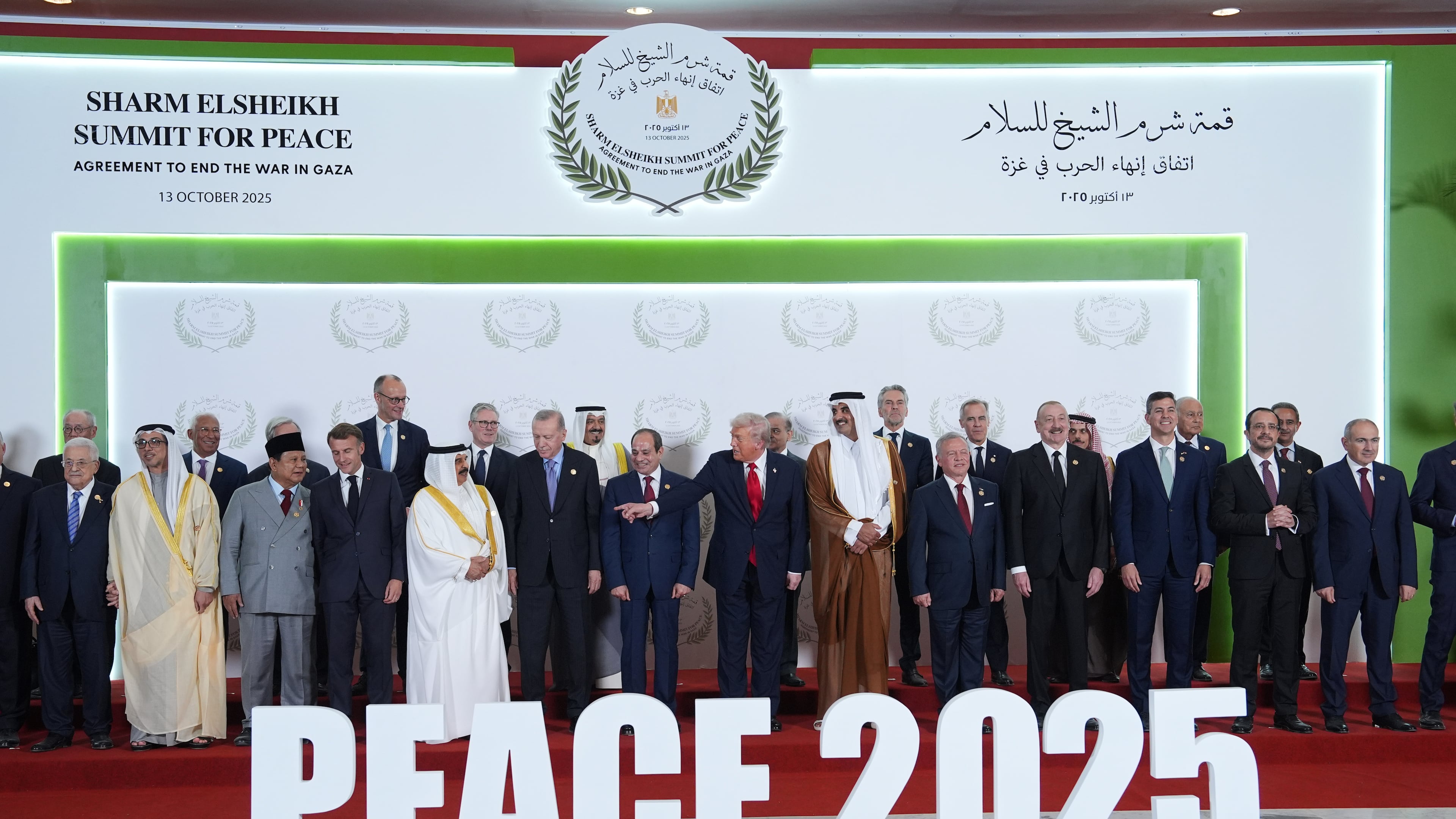 President Donald Trump and other leaders gather for a family photo during a summit to support ending the more than two-year Israel-Hamas war in Gaza after a breakthrough ceasefire deal, Monday, Oct. 13, 2025, in Sharm El Sheikh, Egypt. (AP Photo/Evan Vucci, Pool)