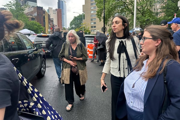 Defense attorney Teny Geragos, center, exits court during the Sean "Diddy" Combs' sex trafficking trial, Tuesday, May 13, 2025. (AP Photo/Ted Shaffrey)