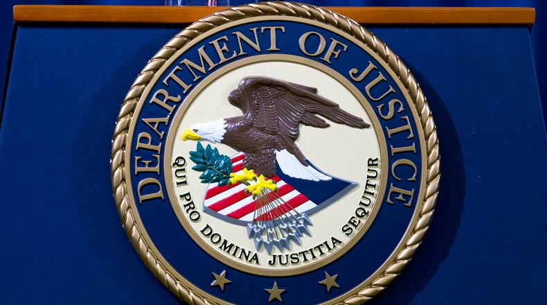 FILE - The Department of Justice seal is seen in Washington, Nov. 28, 2018. (AP Photo/Jose Luis Magana, File)
