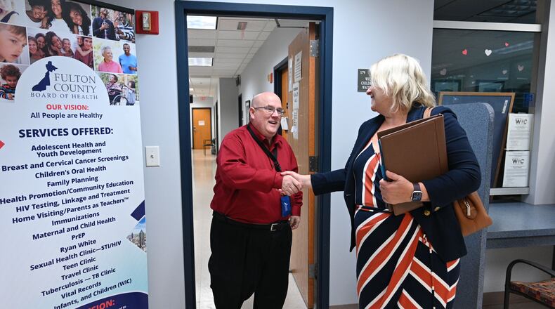 Dwayne Givens, Workforce Development Director, shakes hands with candidate Amy McEver after interviewing her during Fulton County Board of Health Career Fair at North Fulton Regional Health Center on Tuesday in Alpharetta. (Hyosub Shin / Hyosub.Shin@ajc.com)