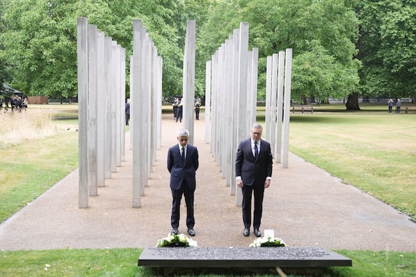 Mayor of London Sadiq Khan, left, and Prime Minister Keir Starmer lay a wreath at the 7/7 Memorial, in Hyde Park to mark the anniversary of the terrorist attacks in London July 7, 2005 that killed 52 people, in London, Monday, July 7, 2025. (Stefan Rousseau/PA via AP)