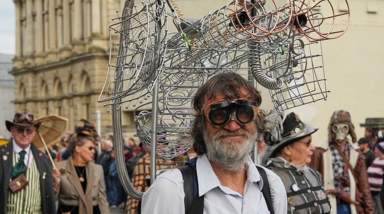 A participant reacts as he marches in a parade at the Steampunk NZ Festival in Ōamaru, New Zealand, on May 30 2026. (AP Photo/Charlotte Graham-McLay)