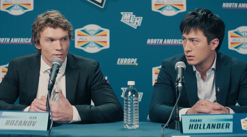 This image released by HBO Max shows Connor Storrie, left, and Hudson Williams in a scene from the series "Heated Rivalry." (HBO Max via AP)