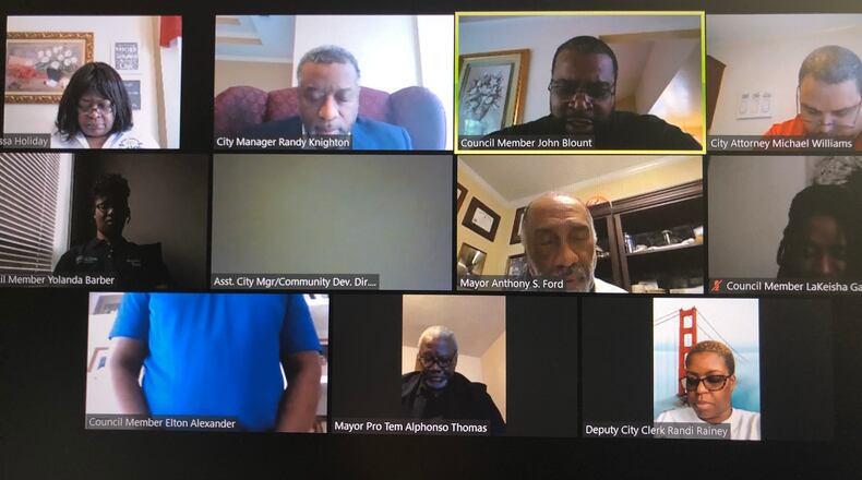 The Stockbridge City Council on Thursday approved a resolution opposing Gov. Kemp’s decision to reopen “non-essential” businesses as early as Friday. LEON STAFFORD/AJC