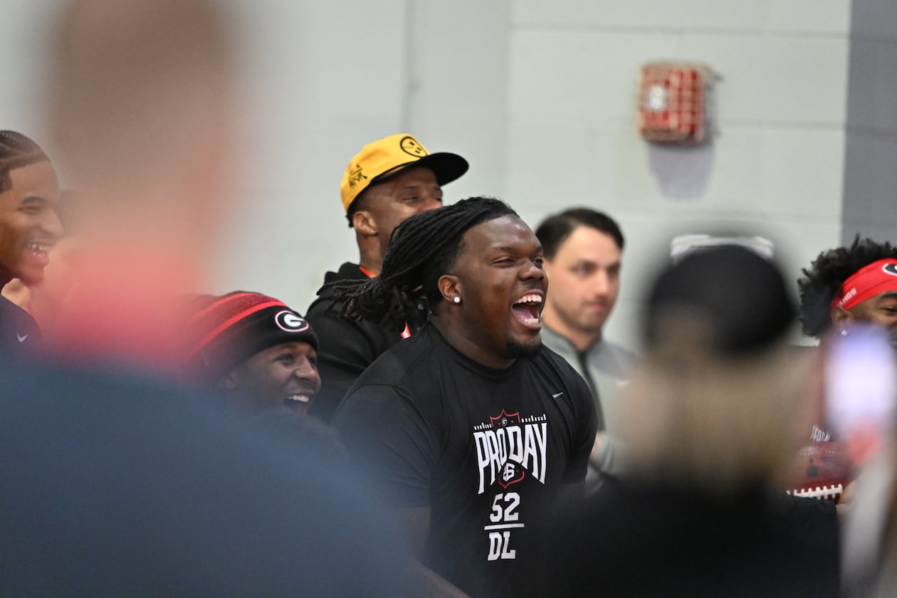 Georgia defensive lineman Christen Miller (center) and other players react during Georgia's NFL Pro Day at Payne Indoor Athletic Facility, Wednesday, March 18, 2026, in Athens. (Hyosub Shin/AJC)