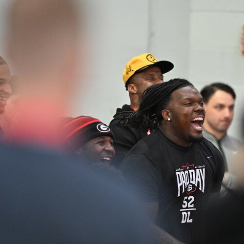Georgia defensive lineman Christen Miller (center) and other players react during Georgia's NFL Pro Day at Payne Indoor Athletic Facility, Wednesday, March 18, 2026, in Athens. (Hyosub Shin/AJC)