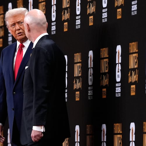 President Donald Trump speaks with FIFA President Gianni Infantino as they leave after the draw for the 2026 soccer World Cup at the Kennedy Center in Washington, Friday, Dec. 5, 2025. (AP Photo/Julia Demaree Nikhinson)