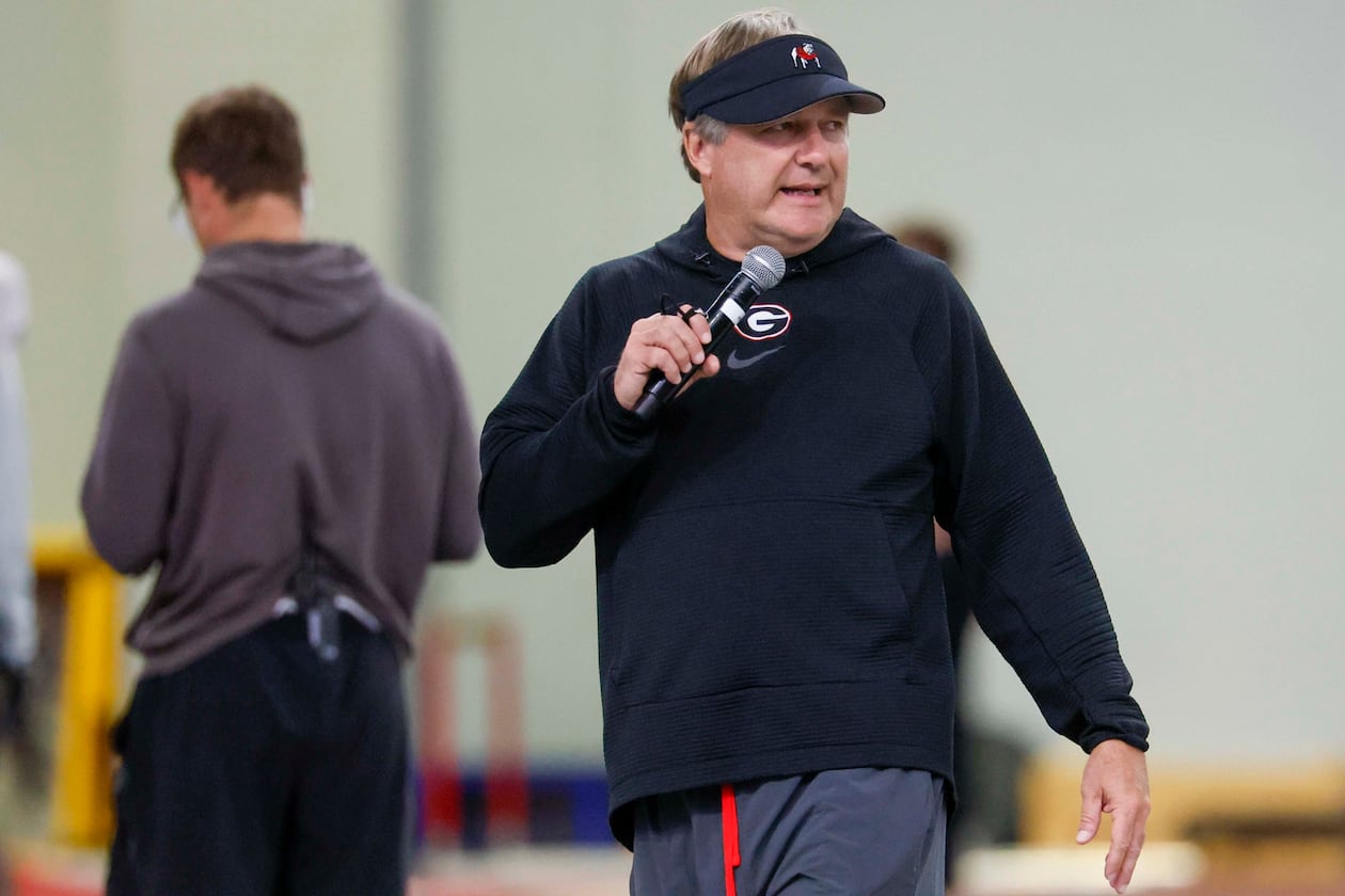 Georgia coach Kirby Smart — pictured giving instructions during practice Wednesday, Aug. 5, 2026 — said of the recent ruling allowing players from the 2022 signing class who have completed four years of eligibility to return for a fifth season: “So, if somebody knew what was coming, kind of like a crystal ball, and they said, ‘We’re gonna sit at 100 so we can bring five guys in,’ they were a lot smarter than me." (Miguel Martinez/AJC)