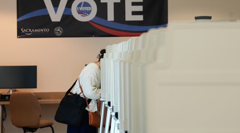 A voter casts her ballot for the California primary election on Tuesday, June 2, 2026, in Sacramento, Calif.. (AP Photo/Rich Pedroncelli)