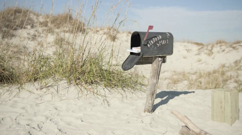 It’s a mile and a half walk to get to the Kindred Spirit mailbox, originally set up as a way for lovers to communicate over 40 years ago on Sunset Beach. Visitors continue to drop off heartfelt messages about love and hope. CONTRIBUTED BY WWW.VISITNC.COM