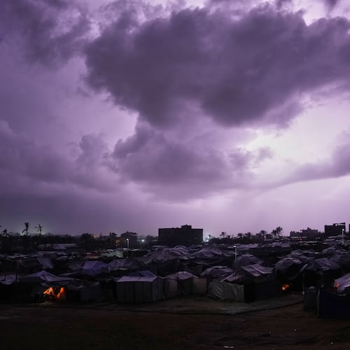 A thunderstorm is seen over a tent camp for displaced Palestinians in Zawaida, central Gaza Strip, Wednesday, Dec. 10, 2025. (AP Photo/Abdel Kareem Hana)