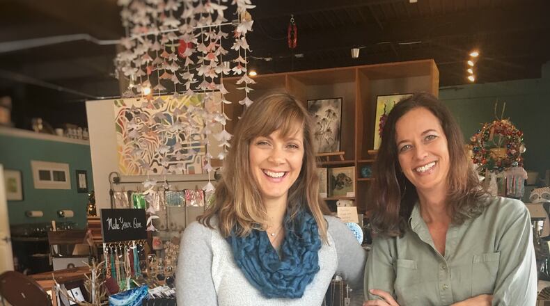 Rachel Herzog (left) and Jen Singh, owners of Avondale Estates’ The Garage Door Studio which is relocating this week to the Tudor Village Building. Courtesy of The Garage Door Studio.