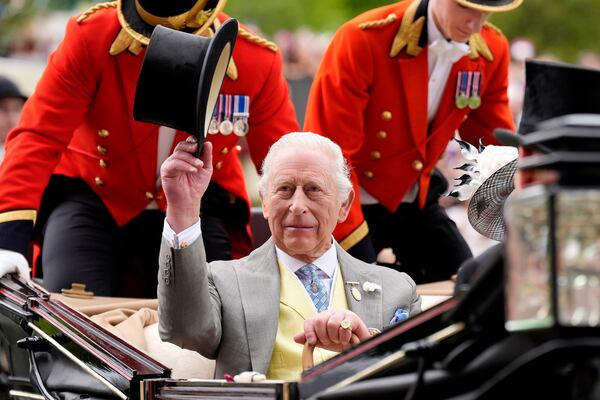 Britain's King Charles III arrives by royal carriage during day five of Royal Ascot at Ascot Racecourse, England, Saturday June 21, 2025. (Andrew Matthews/PA via AP)